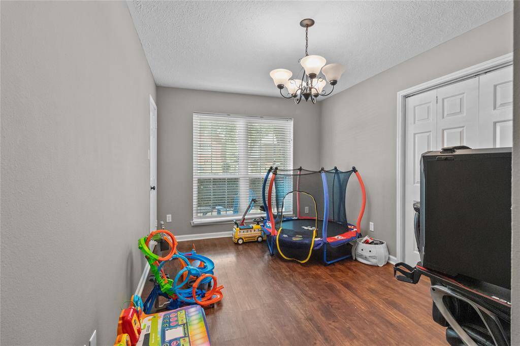 Need a home office, bedroom, or fitness space? This flexible room has you covered.