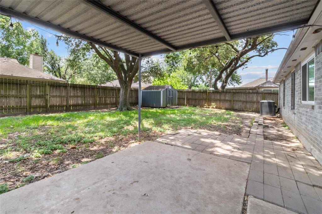Backyard dreams begin here! With a shed and shade trees already in place, you’ve got space to grow.