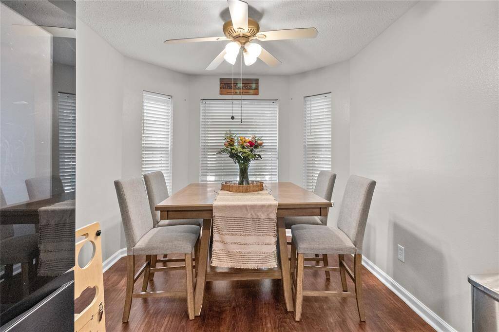 A charming bay window floods the breakfast room with natural light — perfect for daily meals or special occasions.