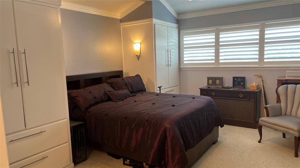Primary bedroom with custom closets.
