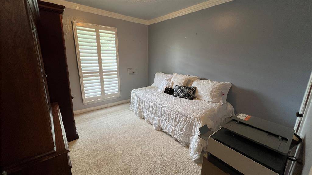 Bedroom #2 with plantation shutters.