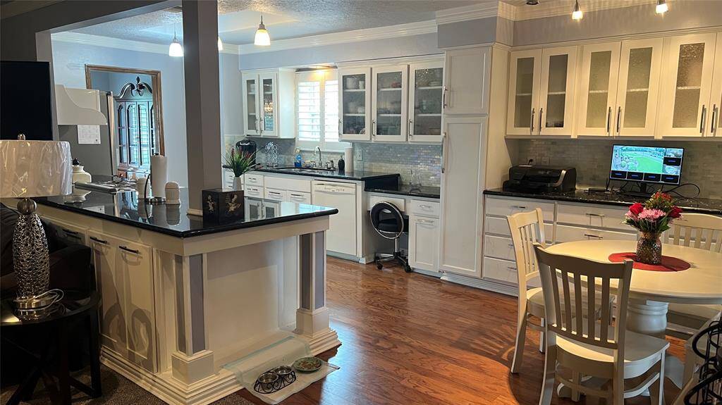 Glass door cabinets add an elegant touch.