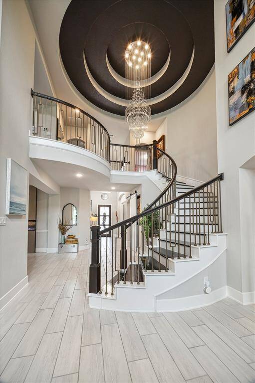 Chandelier with custom lift for easy access.