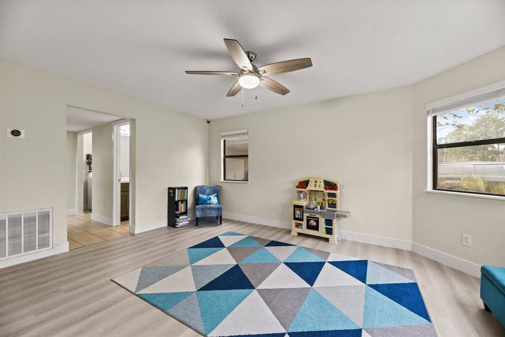 This flex space is currently used as a downstairs game room but the possibilities are endless!