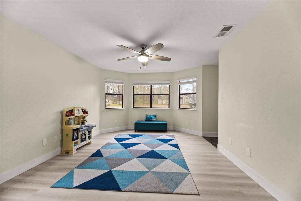 Notice the beautiful bay window in this room.