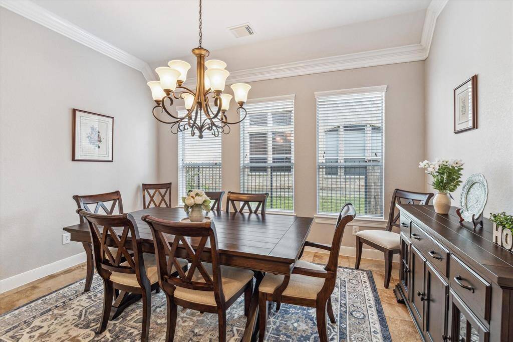 The neutral walls and decorative touches create a warm, inviting atmosphere, perfect for entertaining.
