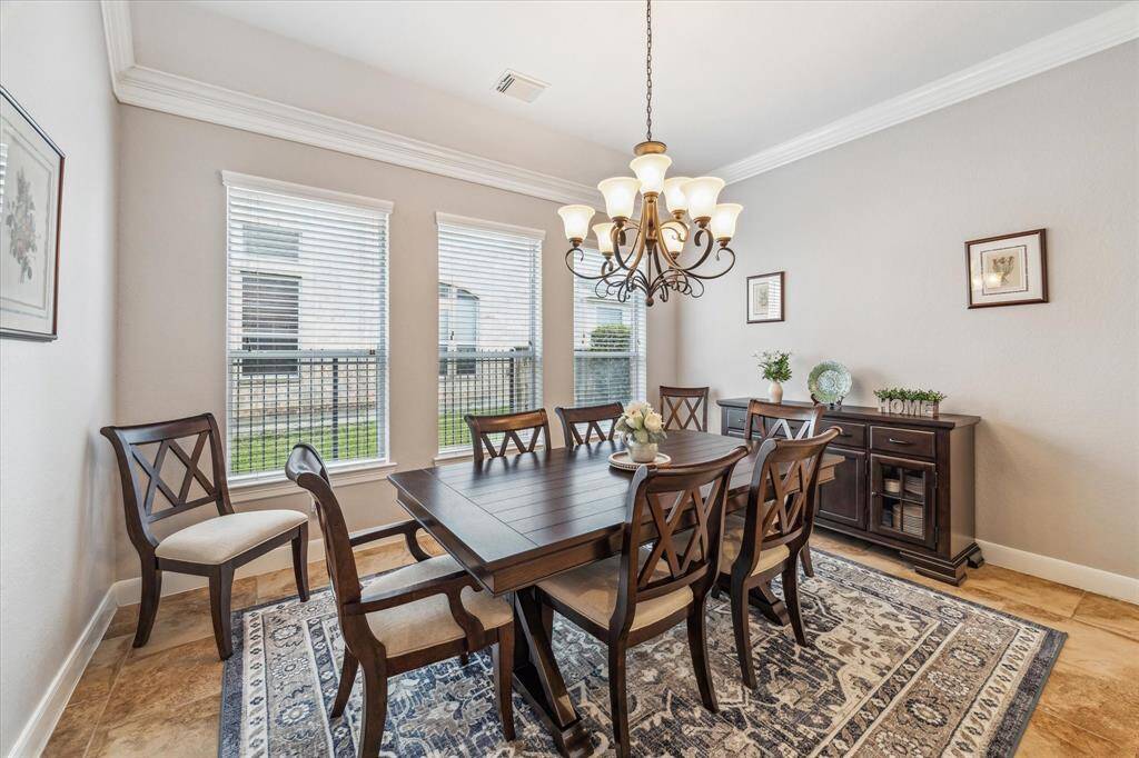 The neutral walls and crown molding add elegance to the space.