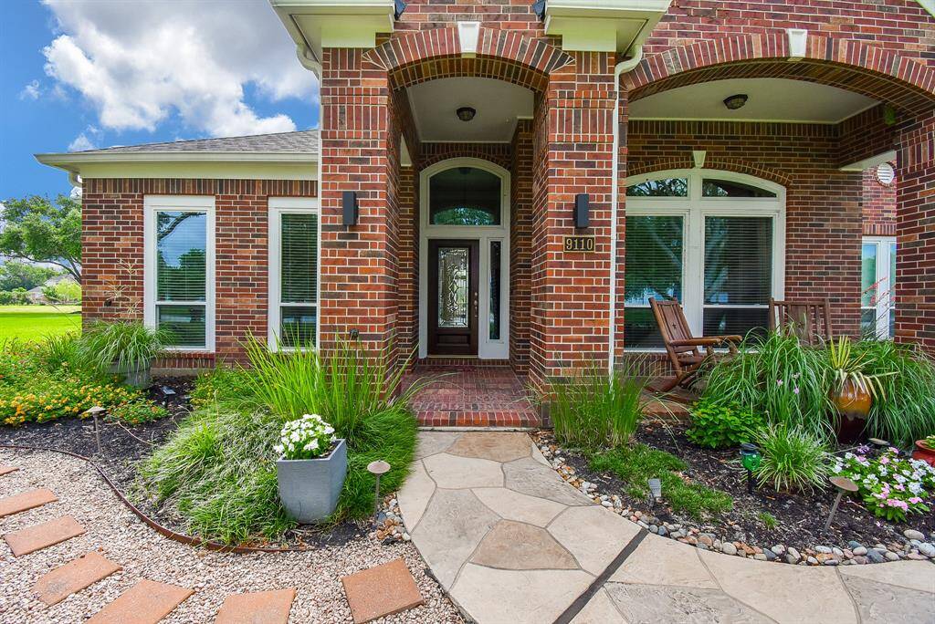 Sit and stay awhile on the brick lined front porch ... now let's go inside for a jaw-dropping tour of complete excellence.