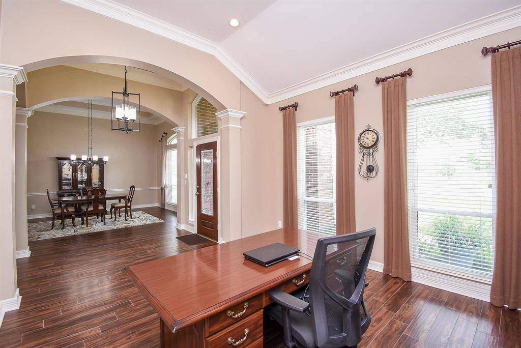 Private office with floor to ceiling windows bringing in natural light and a beautiful view of your acreage.