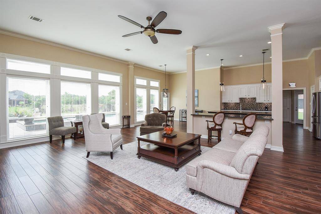 All new lighting and ceiling fan, new wood tile flooring ... open, light and bright.