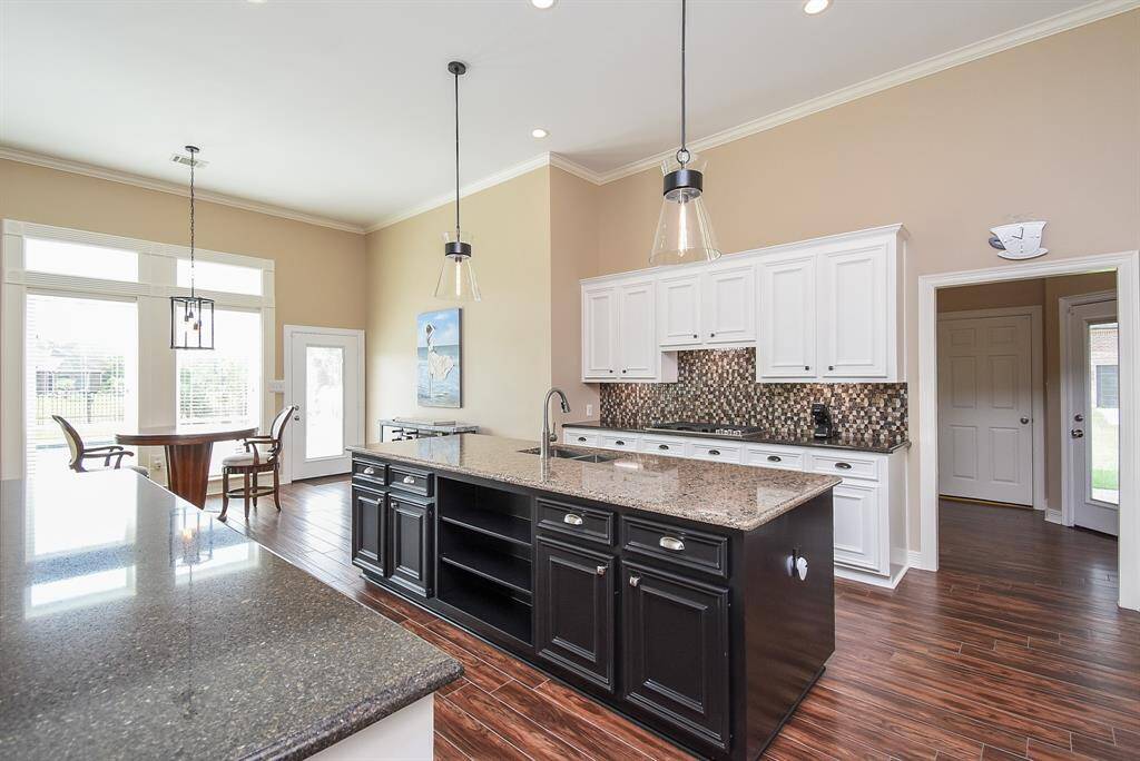 A dream kitchen fit for a chef or a mom!  Beautiful, yet functional.  The door frame to right leads to a second bedroom with full bath and large closet (a second primary).