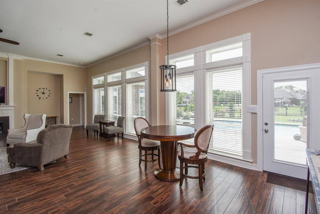 Breakfast nook overlooking your 3/4 acres, gorgeous pool, lake  and professionally updated landscaping.  See next photo for the WOW FACTOR...