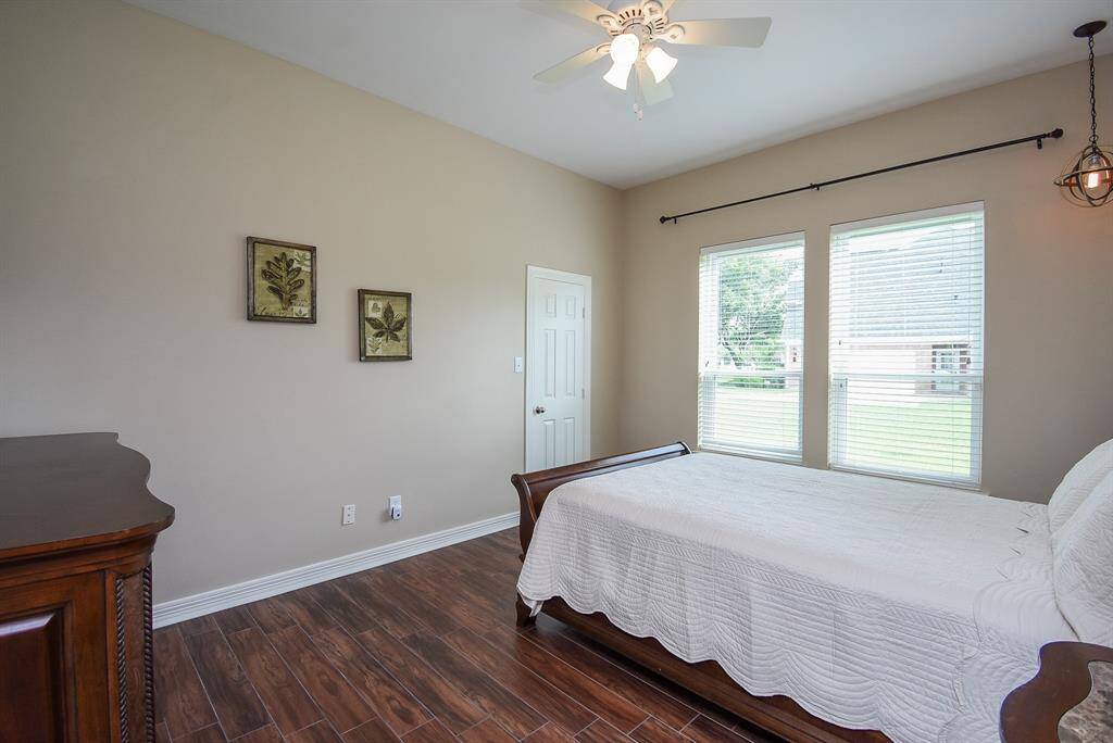Bedroom 3 is good size with floor to ceiling windows.