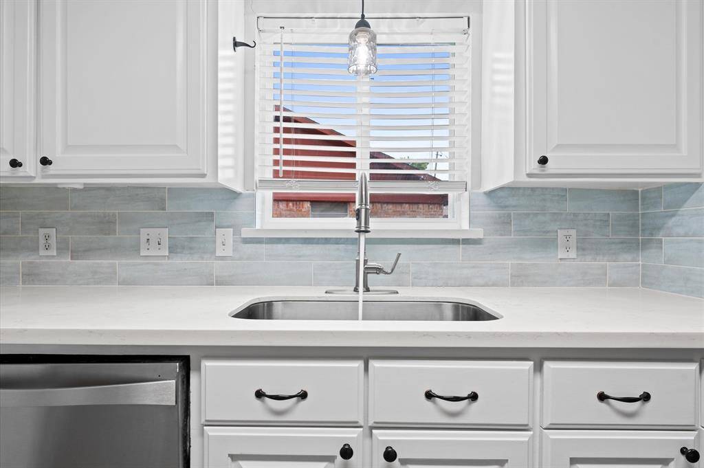 Dining room with plenty of natural light from the large front windows1