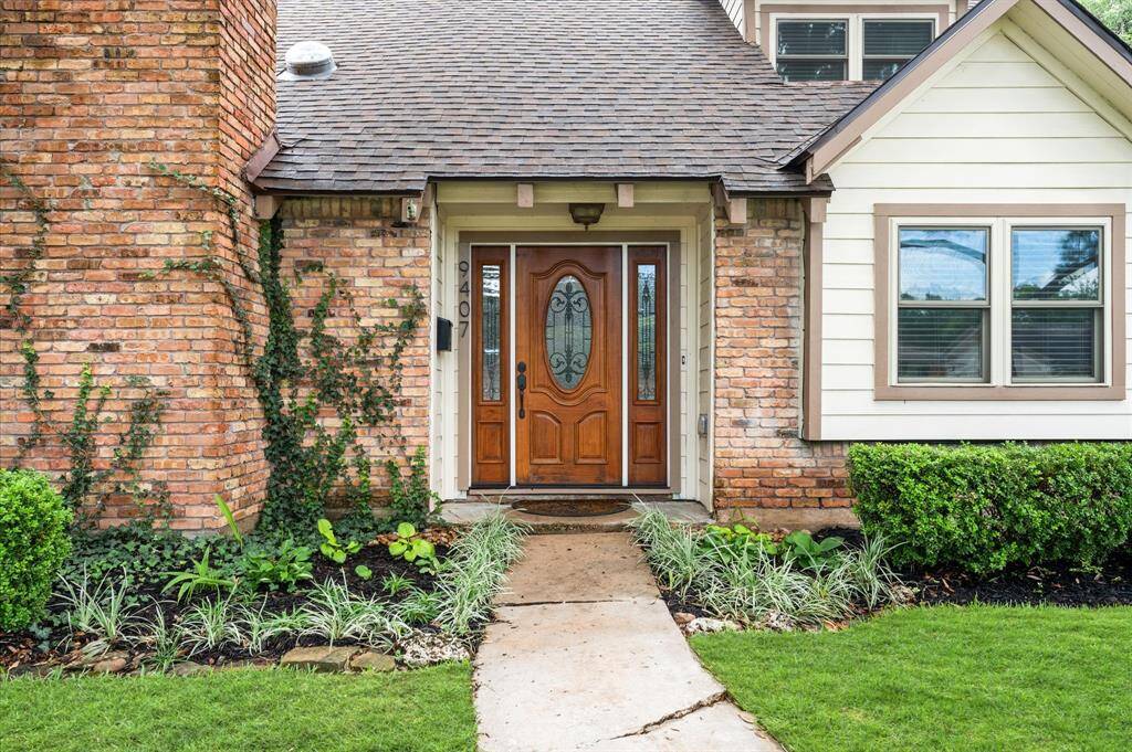 The front entrance highlights a beautiful wooden door with decorative glass panels, adding charm and character!