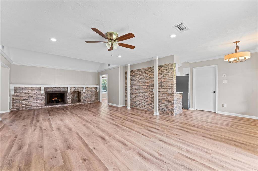 Different view of the living room. Ceiling fan and recessed lighting add elegance. Open layout connects to the breakfast and kitchen!