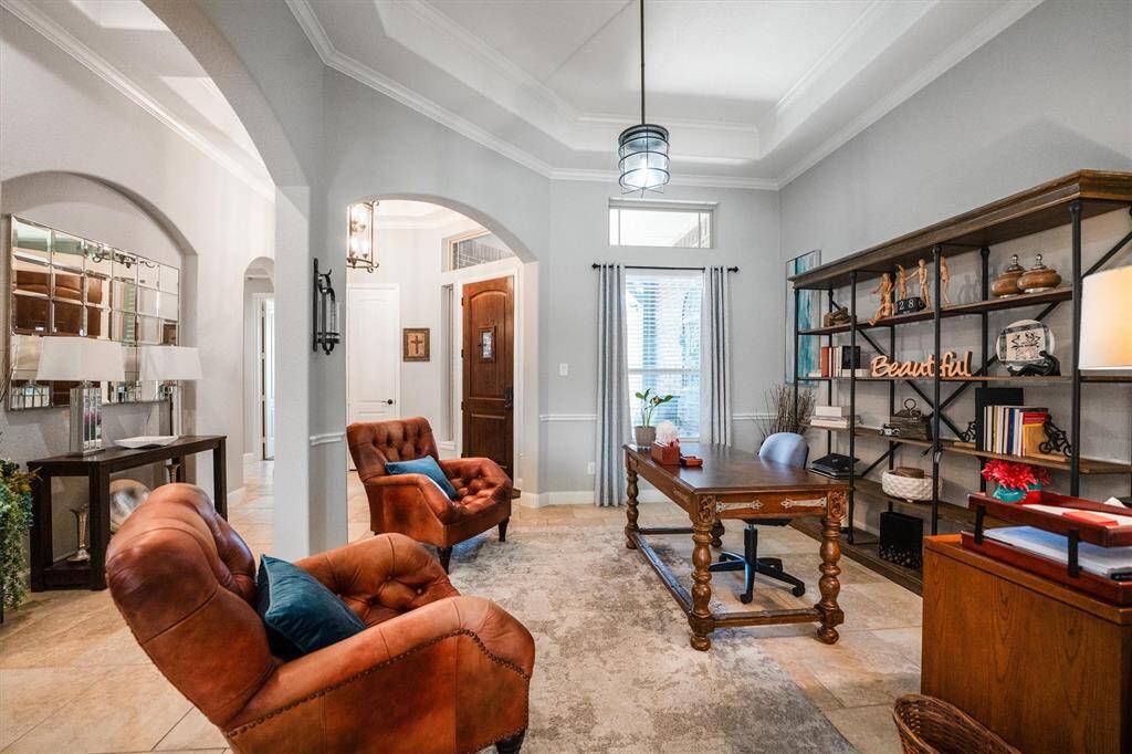This versatile front room is currently an office but can easily transform into a formal dining area or flexible space to suit your needs.