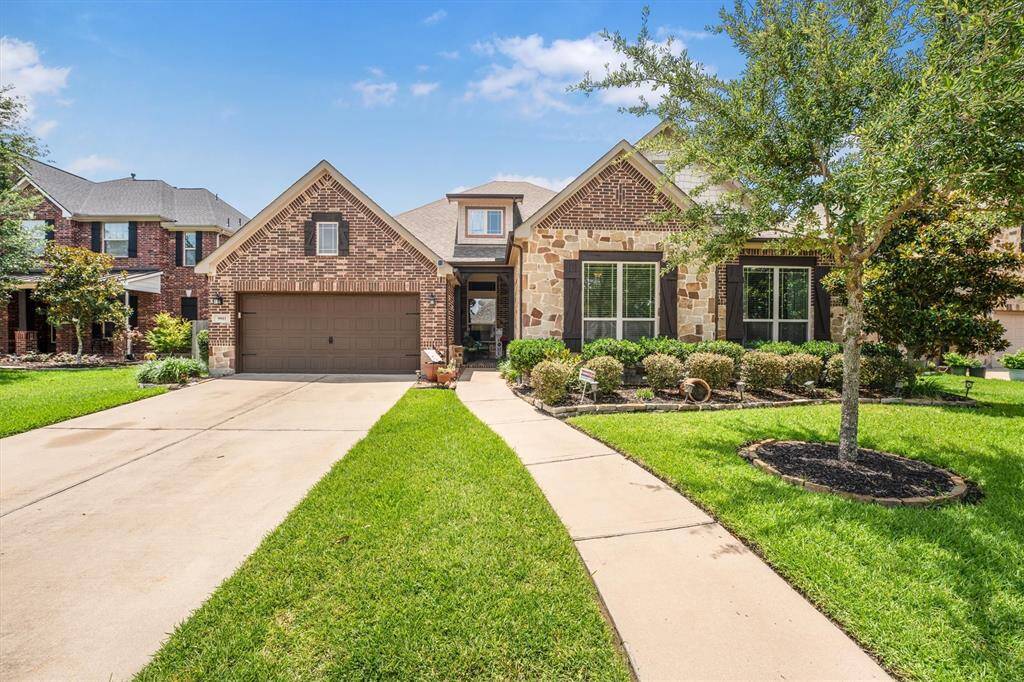 Inviting entrance with a charming, extended walkway.