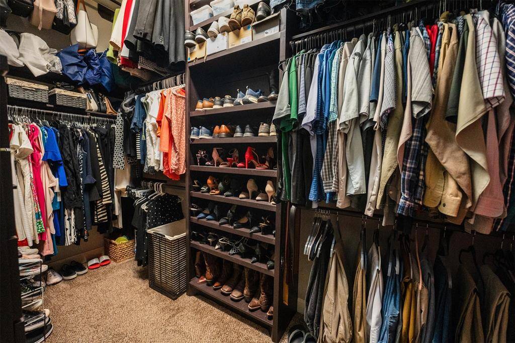 Discover the ultimate custom closet, featuring extensive storage, a dedicated shoe rack, and ample drawers to meet all your organizational needs.