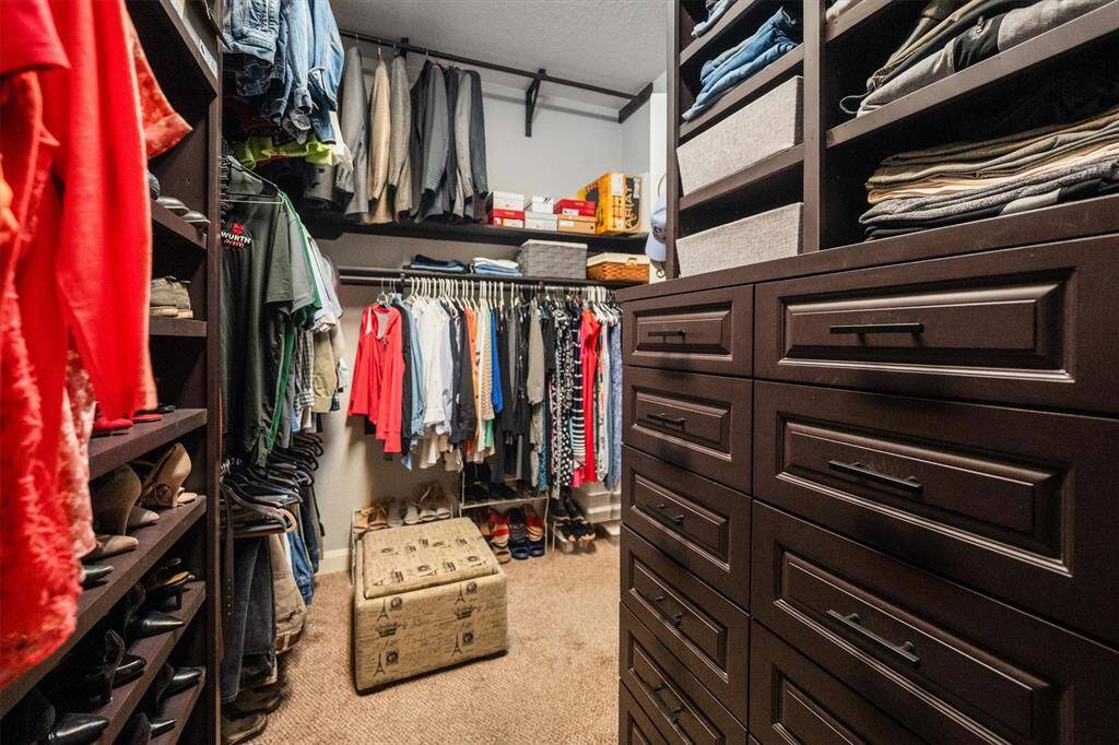 Another View of this custom primary closet, designed for ultimate organization and style.