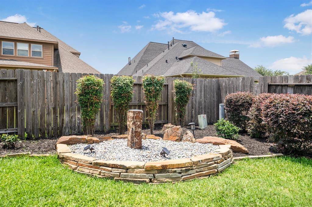 This tranquil water fountain enhances your outdoor oasis.