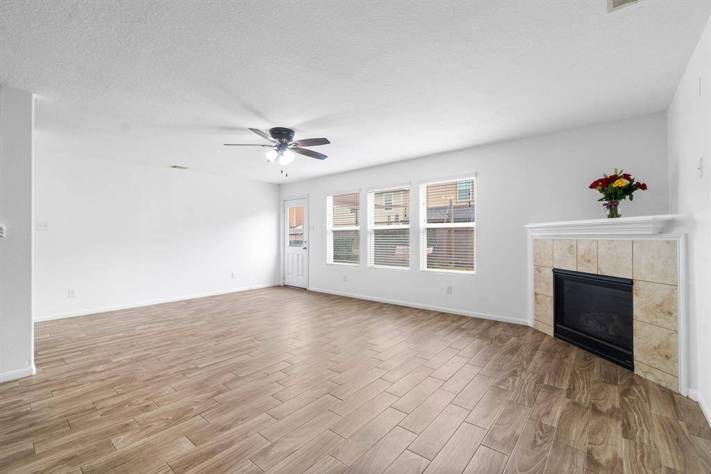 Open living room with corner fireplace