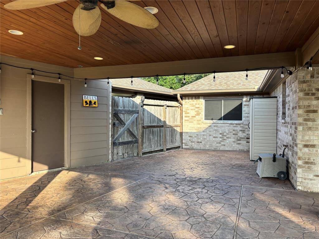 Close view of gorgeous patio, with ceiling fans, electricity, lighting.