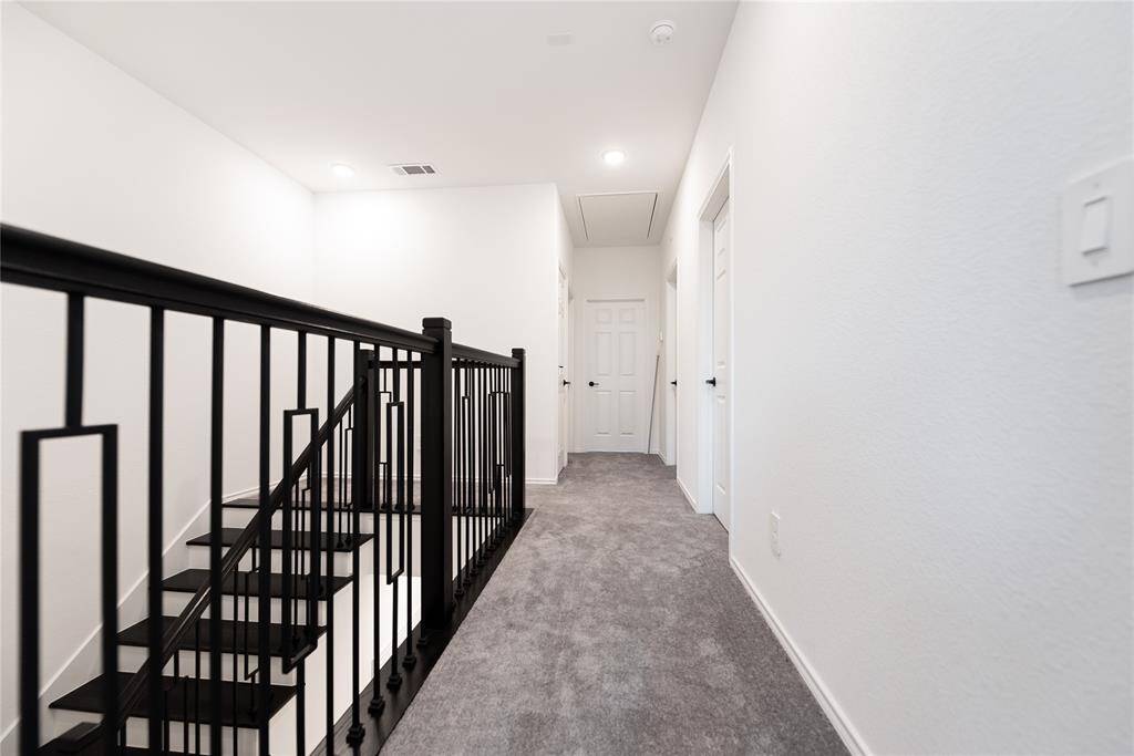 a modern, well-lit hallway .