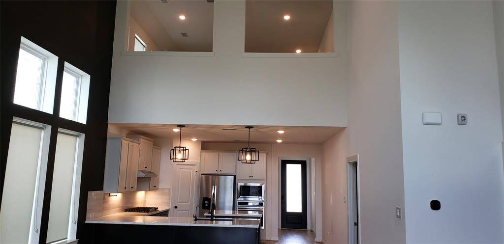 Spacious and open, the great expansive room seamlessly flows into the kitchen, creating the perfect setting for both everyday living and effortless entertaining.