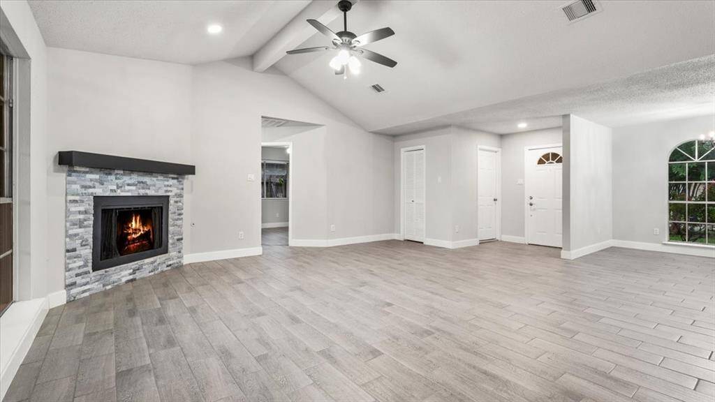 ( virtually staged ) Open concept floor plan. High ceilings. Brand new tile flooring installed. New paint all throughout.