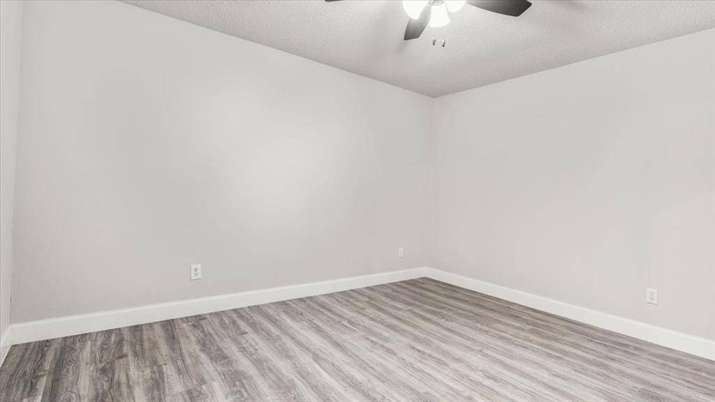 Primary Bedroom with private entrance to backyard.
