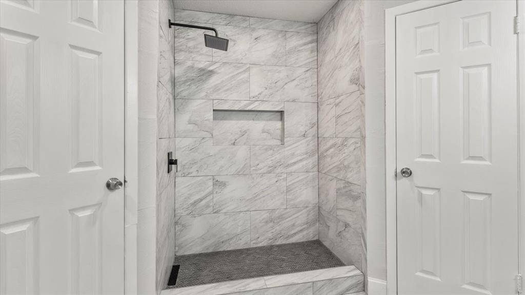 Spacious Primary bedroom with private entrance to backyard. New flooring installed all throughout. New paint.