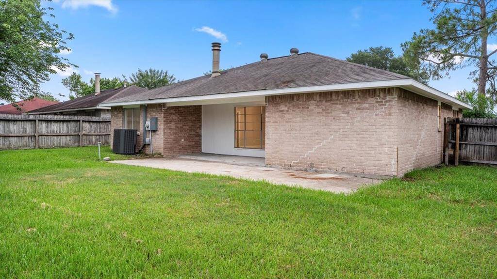 Spacious backyard with covered patio