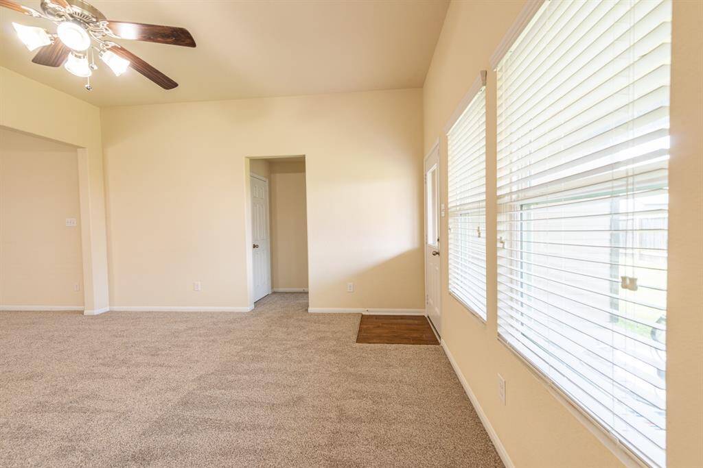 family room looking into primary bedroom entry and storage closet to the left