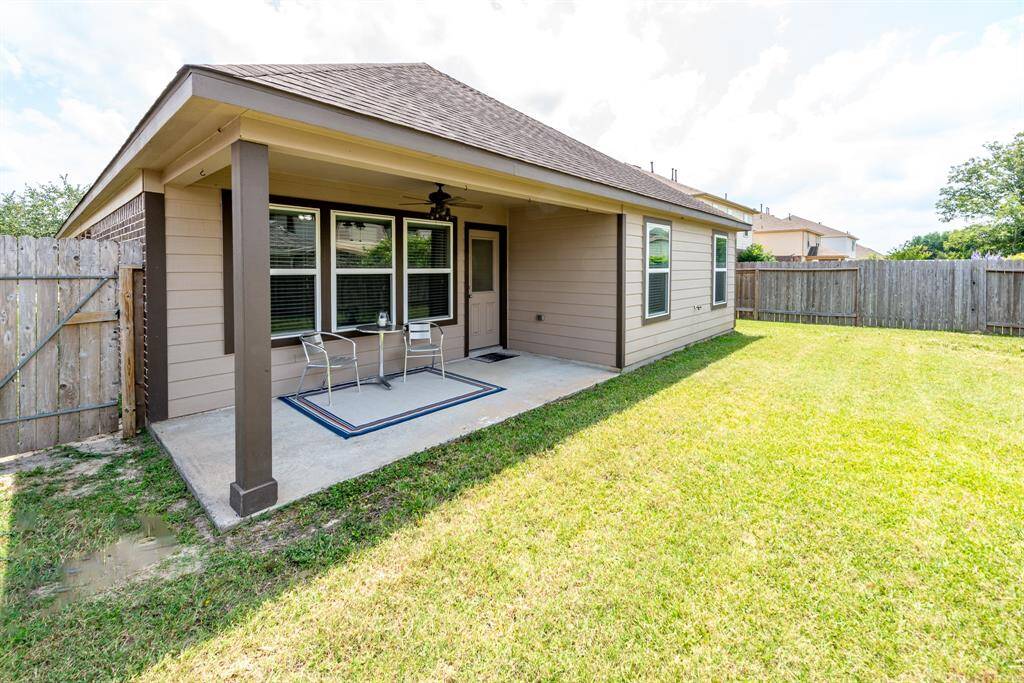 backyardand covered patio with fan