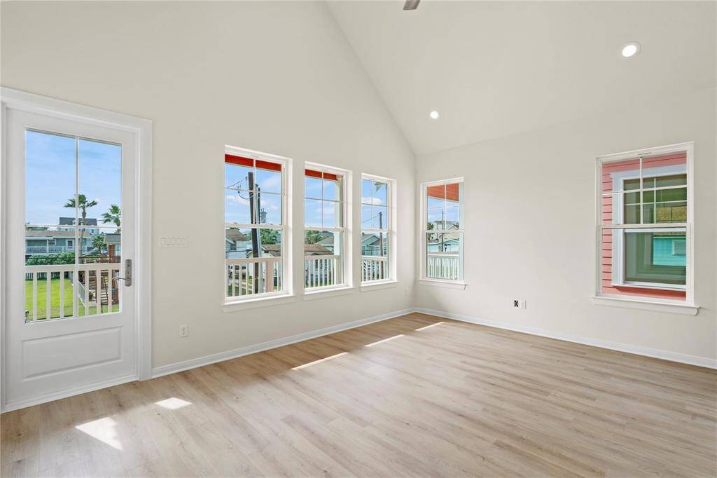 TONS OF NATURAL LIGHT AND CELLING FAN IN LIVING WITH DIRECT ACCESS TO WATER VIEW BALCONY!