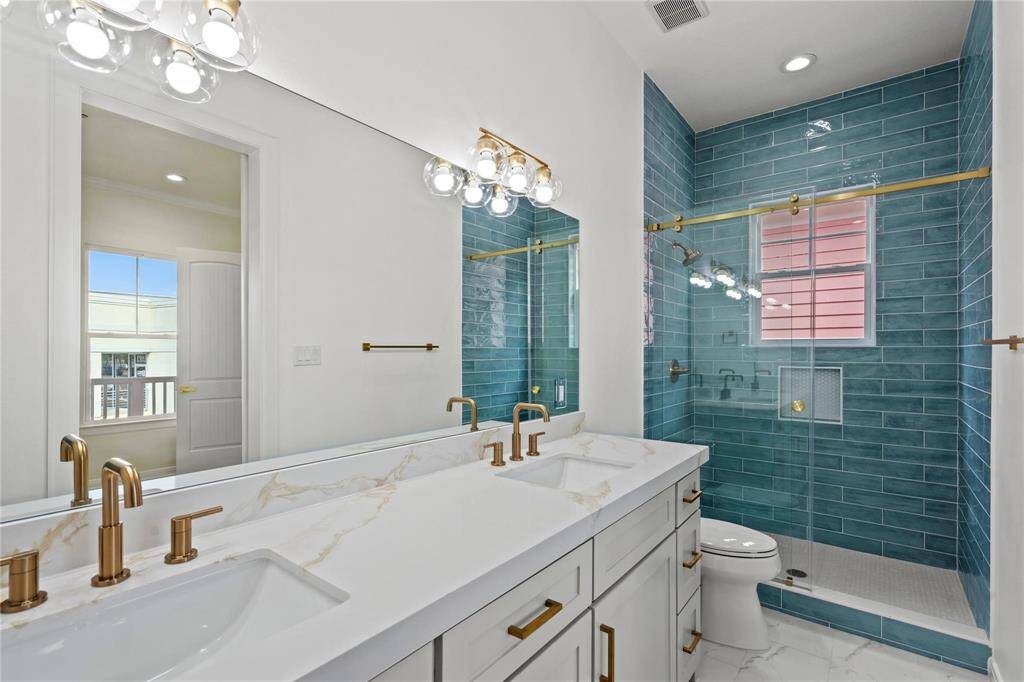 PRIMARY BATH WITH BEAUTIFUL DESIGNER FINISHES.