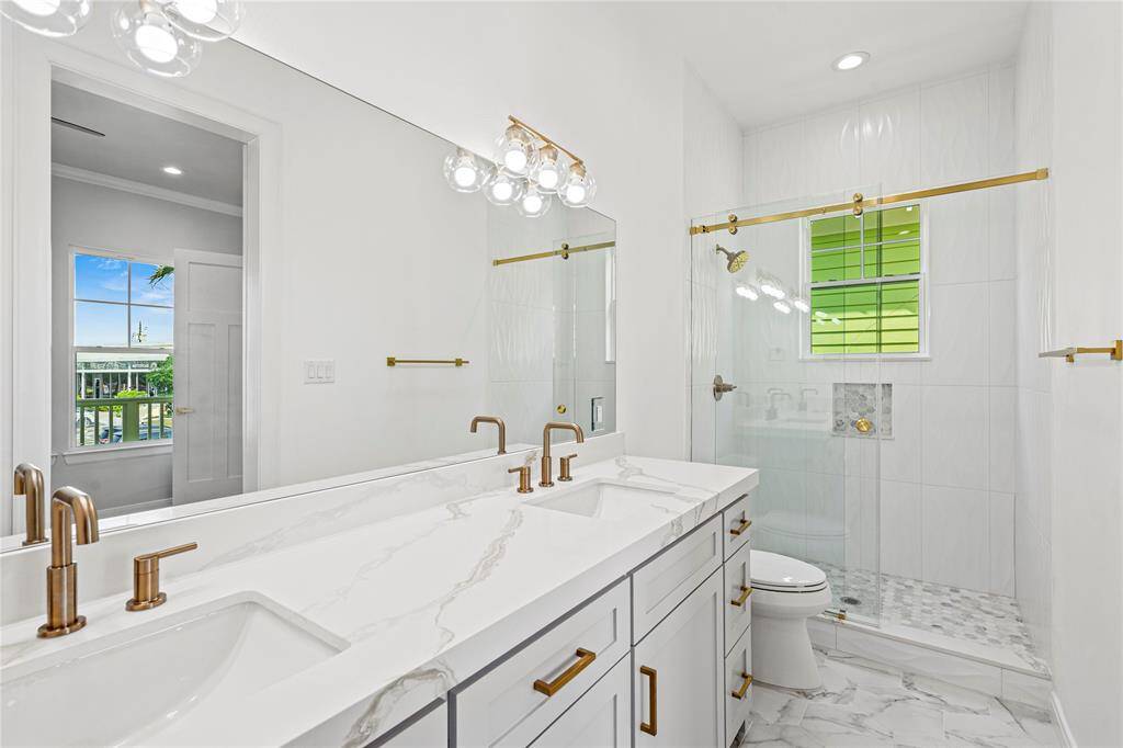 PRIMARY BATH WITH WALK IN SHOWER AND DESIGNER FINISHES!