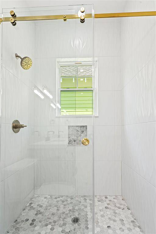 PRIMARY WALK IN SHOWER WITH DESIGNER FINISHES!