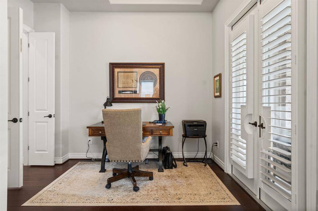 Spacious Primary Bedroom features a sitting area or office space with immediate access to back patio.
