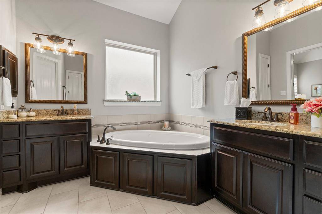 Primary bathroom is in pristine condition.