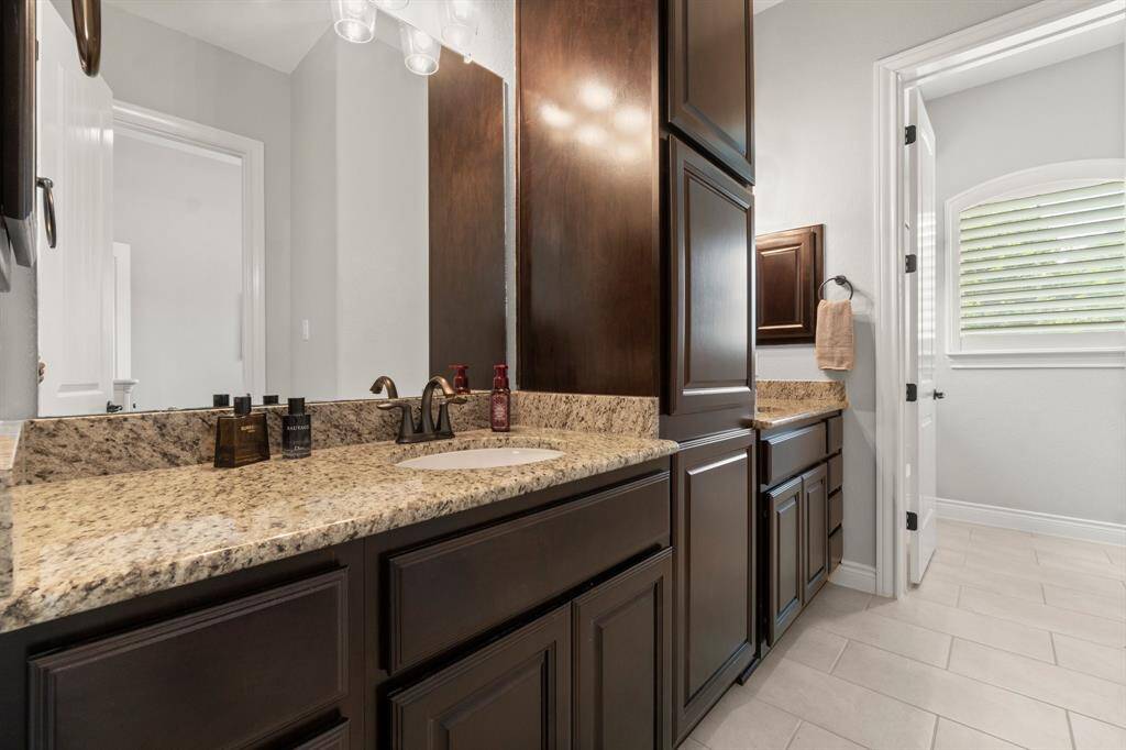Bathroom connects to both bedrooms.
