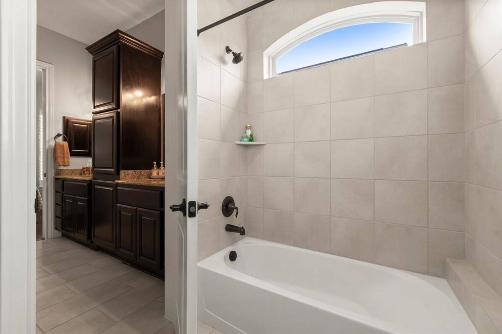 Bathroom connects to both bedrooms.