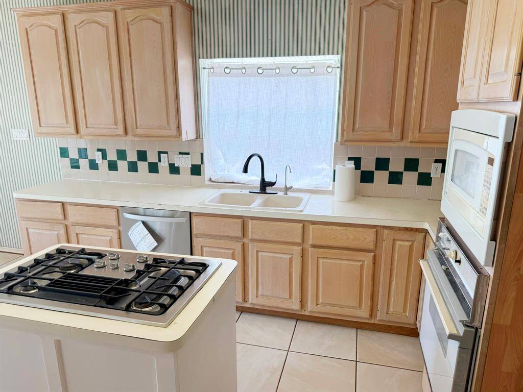 Cooktop Island Kitchen with lots of space to create and plenty of storage.