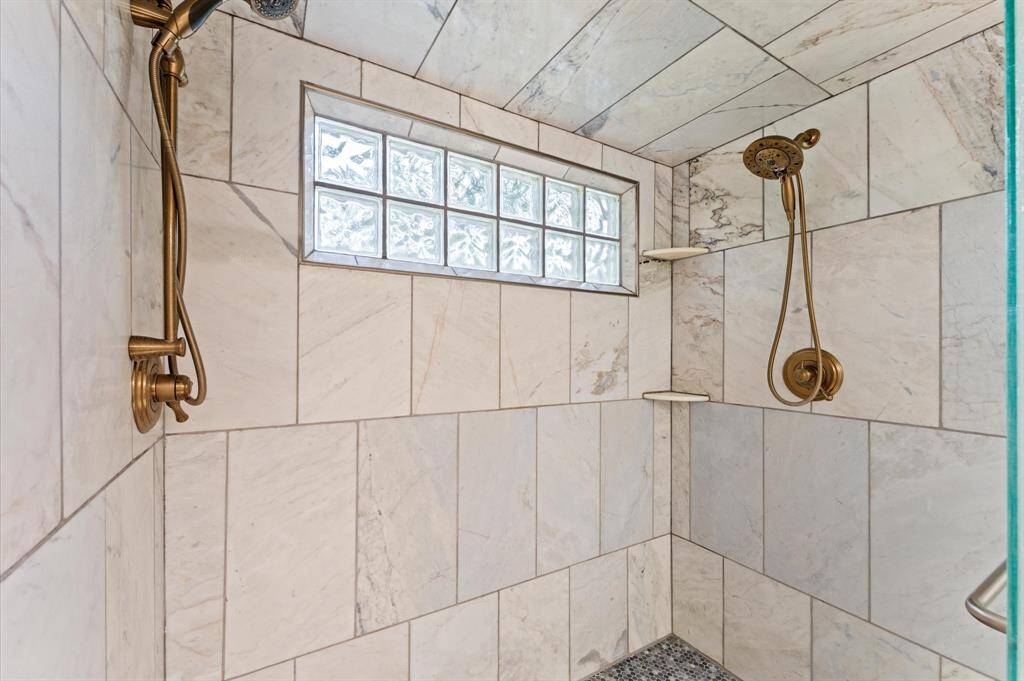 Walk in shower with dual shower heads and controls