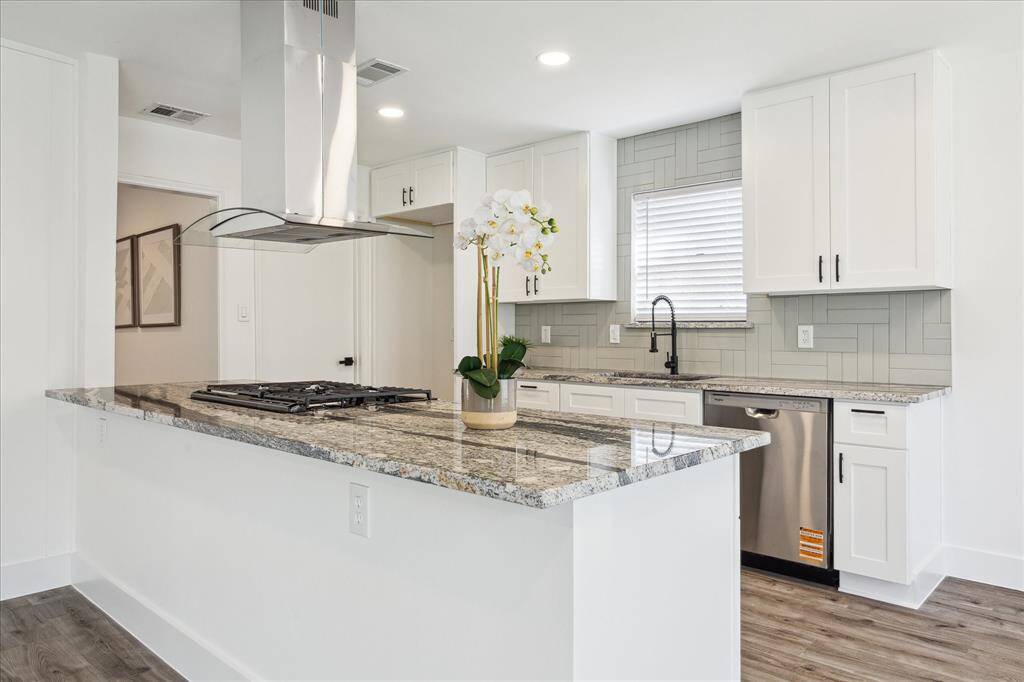 The family room is bright and open with direct access to the kitchen, dining room, and breakfast area