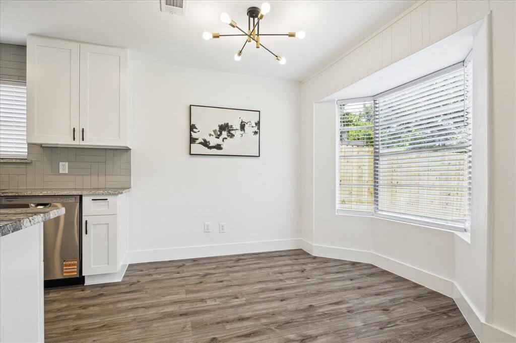 Cozy and inviting with a large bay window that fills the breakfast area with natural light.