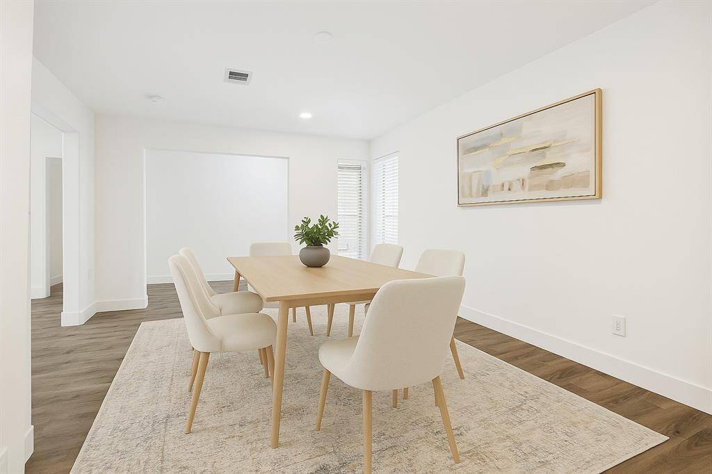 The dining room is conveniently located to the left of the entryway with easy access to the kitchen—ideal for entertaining.