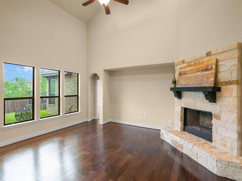 Cozy up to this elaborate stone fireplace with your family while watching your favorite tv shows.