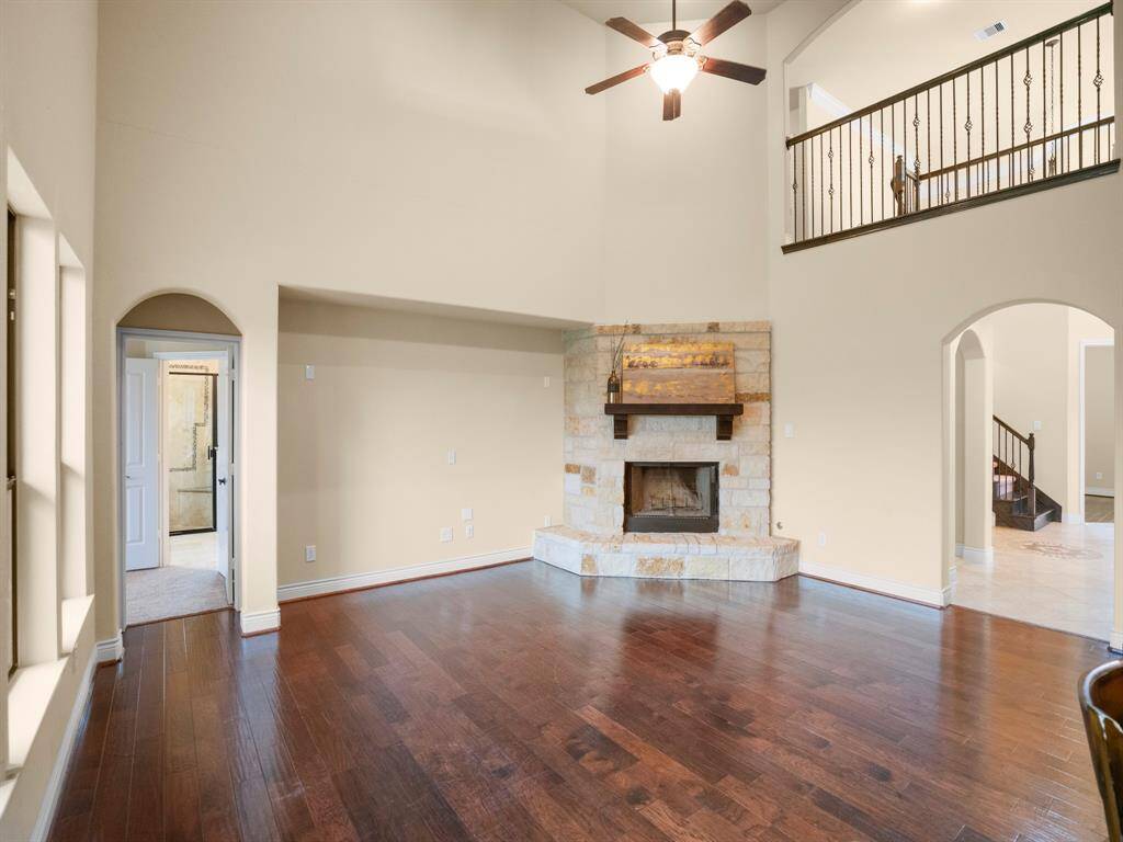 This family room has enough space to hold as much furniture as you need. And lots of natural light from all the family room windows. Notice the catwalk above peeking down at you.